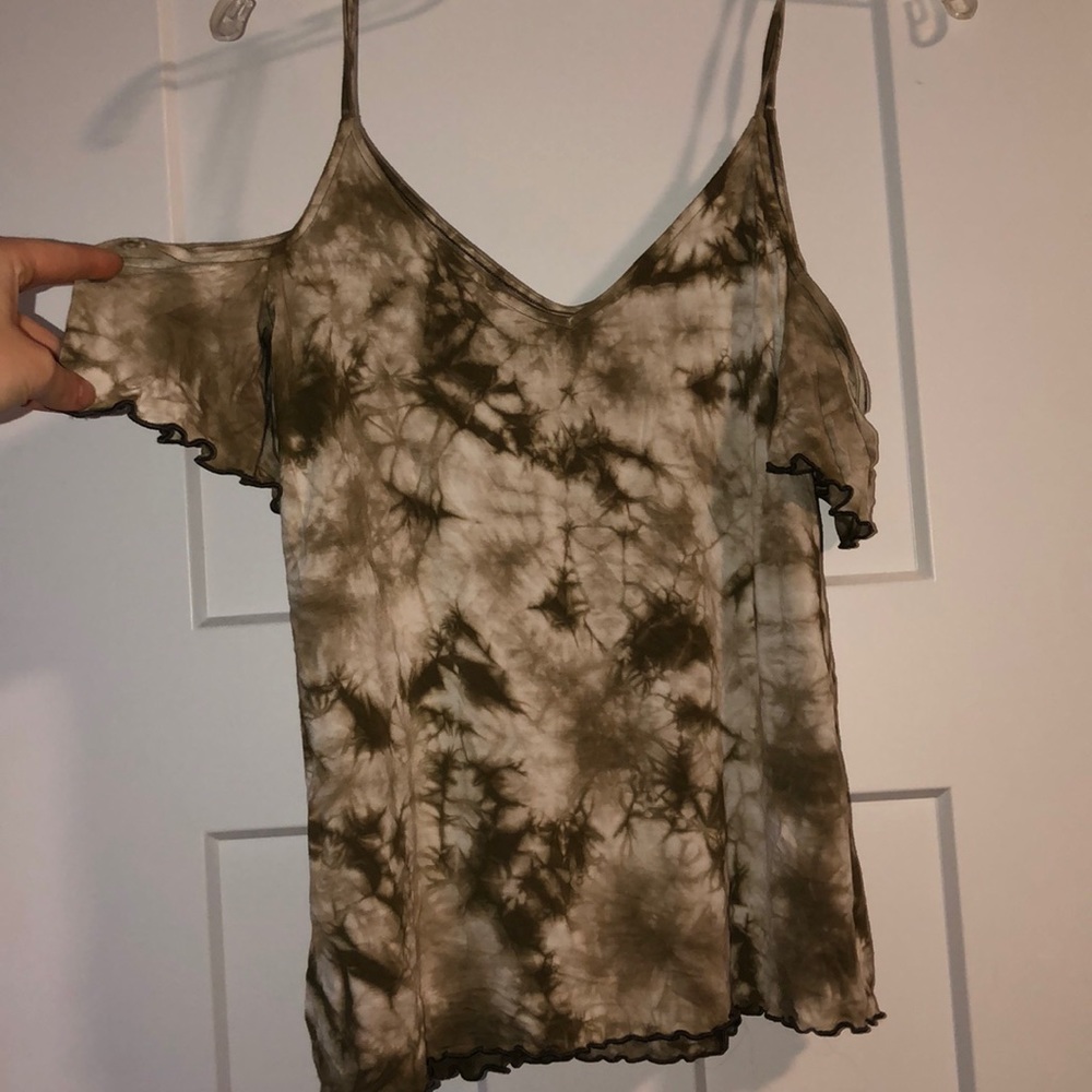 green and white shirt with shoulder cutouts